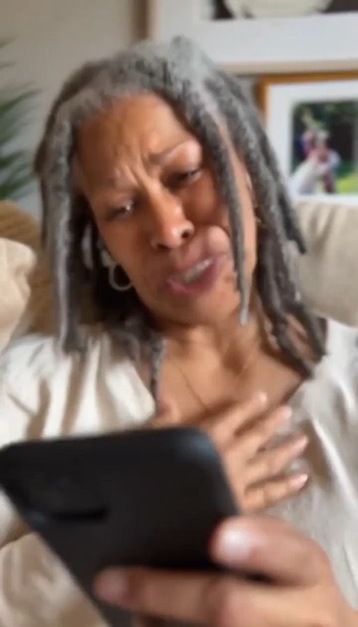 Real emotional reaction while listening to a personalized prayer song on a phone